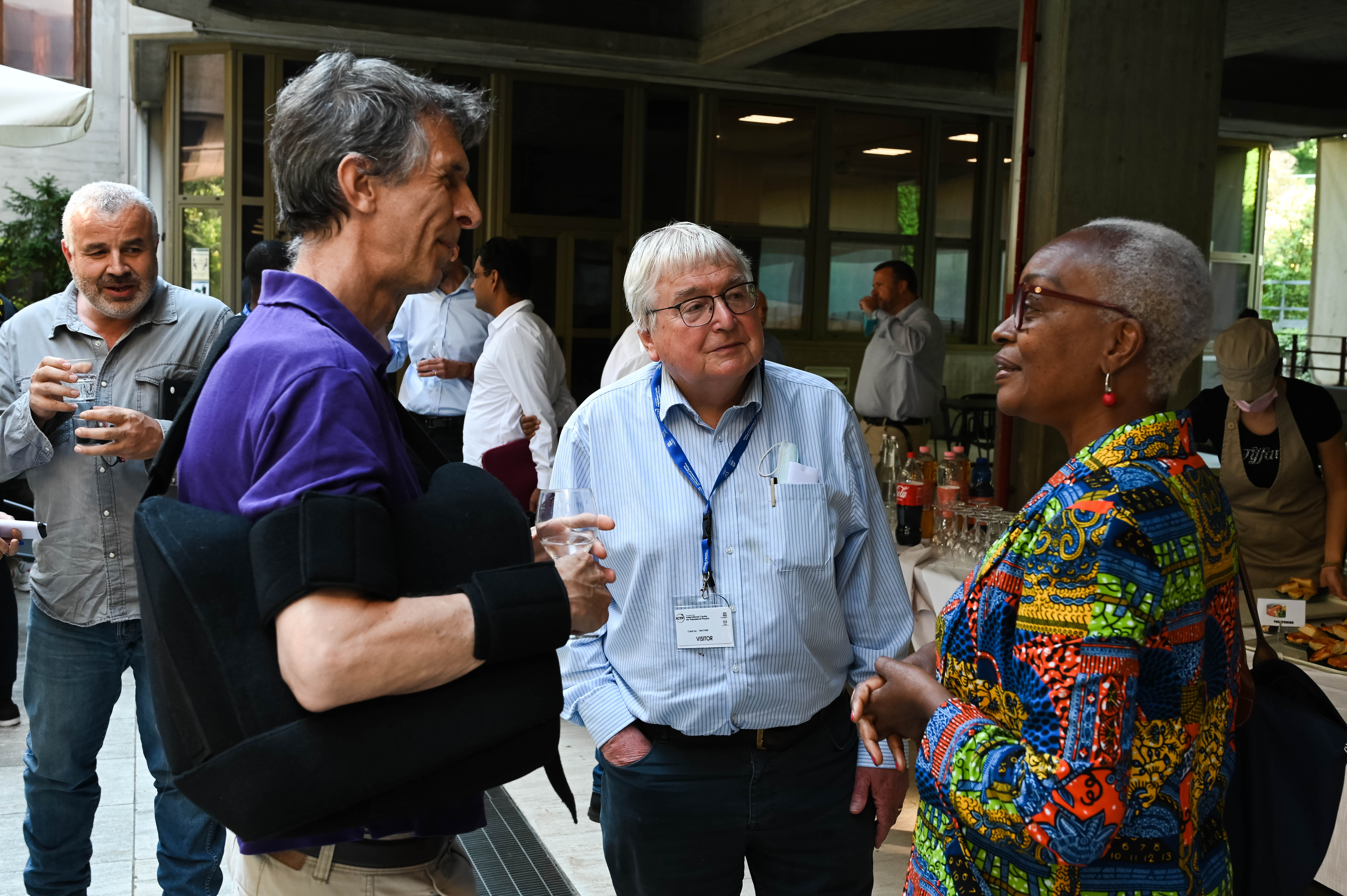 Richard Catlow talking to some of the members of the IAP Trieste Secretariat 