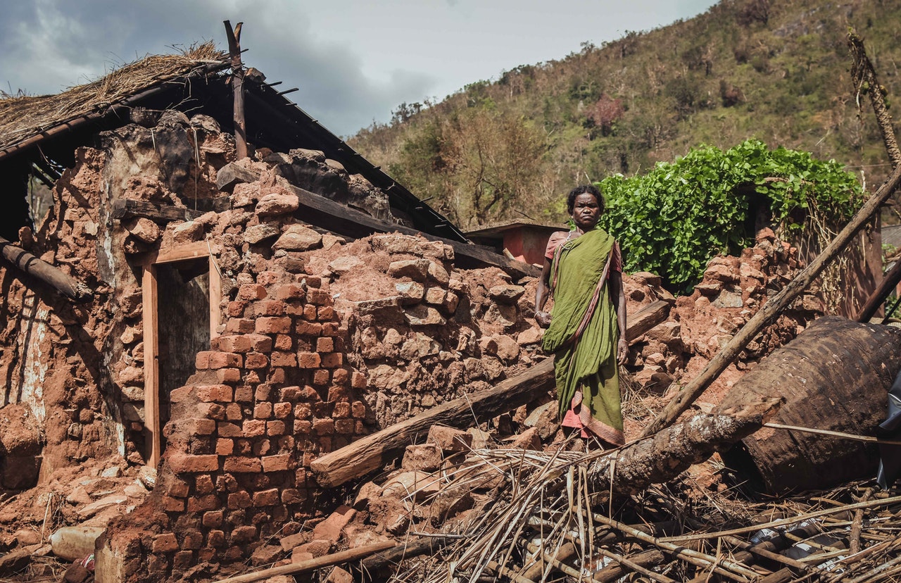 woman standing in front of a house