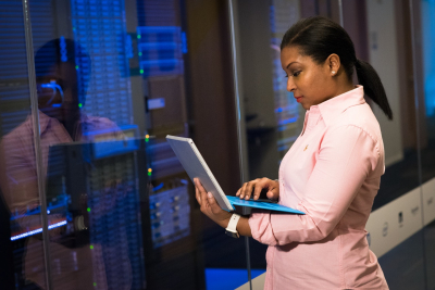 Photo Of Woman Holding A Gray Laptop